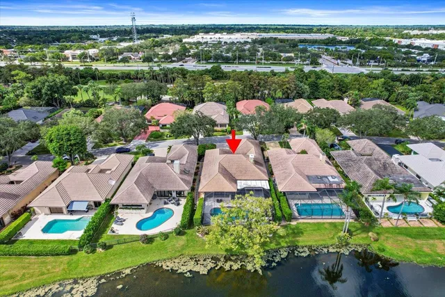 an aerial view of residential house with outdoor space and swimming pool