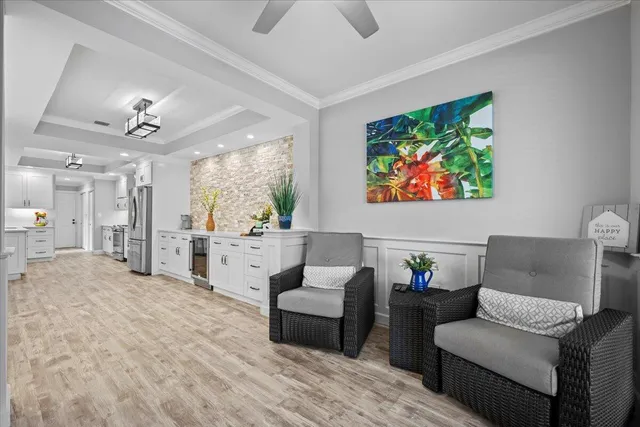 a kitchen with granite countertop white cabinets and sink