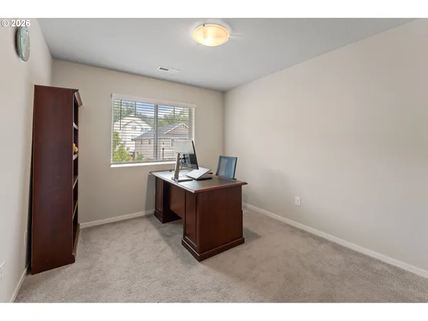 a room with a window and a flat screen tv