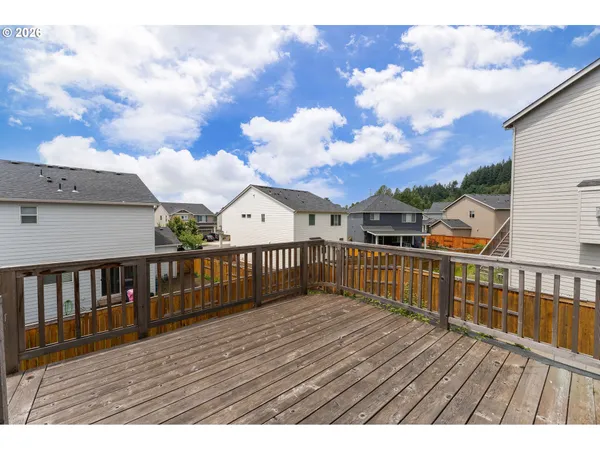 a view of a balcony with wooden floor