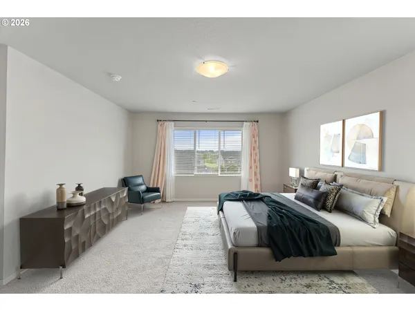 a spacious bedroom with a bed and glass window
