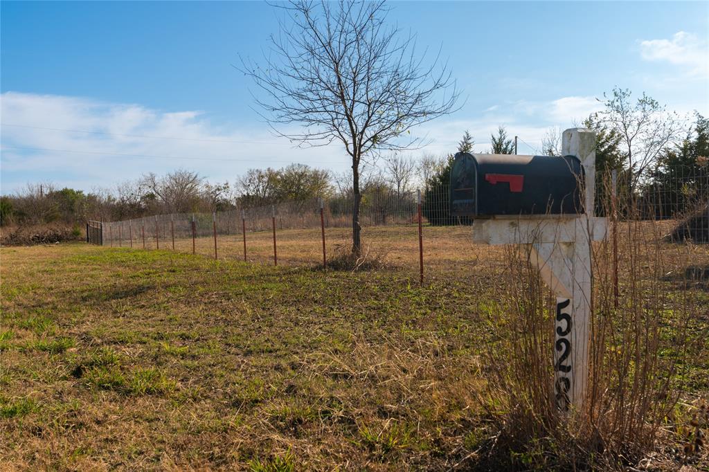 528 County Road 3824 Wills Point, TX 75169 - Photo 12 of 13 a view of a yard with wooden fence