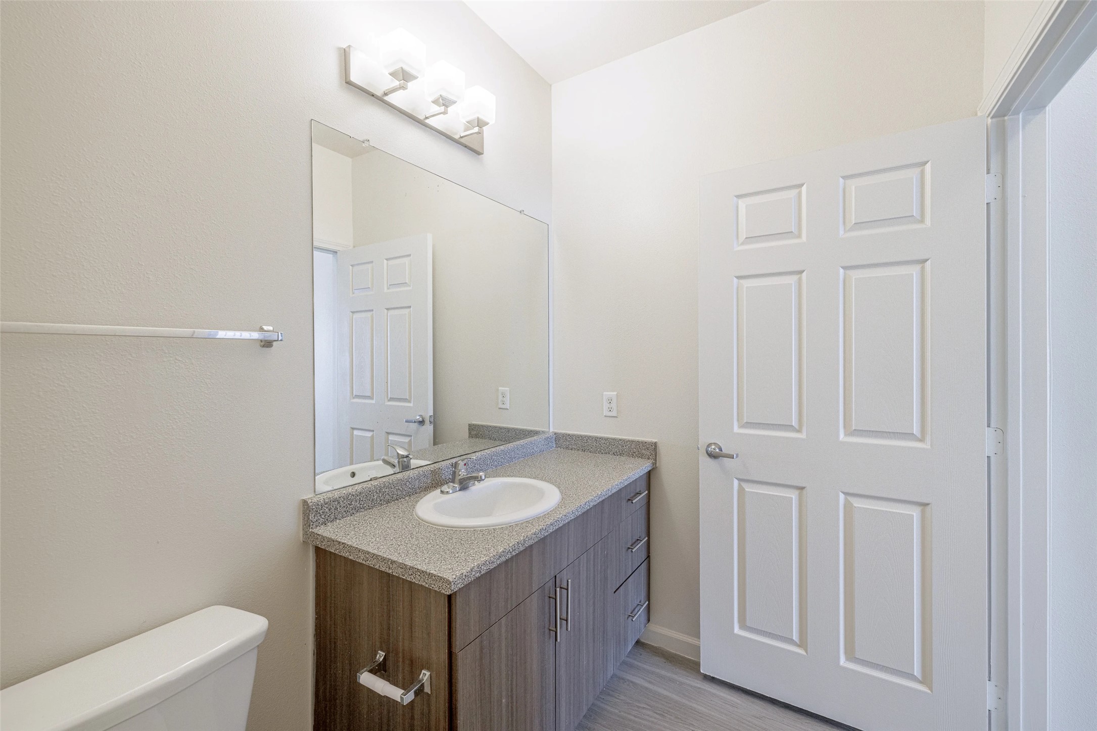 5605 Springdale Road, Unit 444421 Austin, TX 78723 - Photo 5 of 21 a bathroom with a sink vanity and a mirror