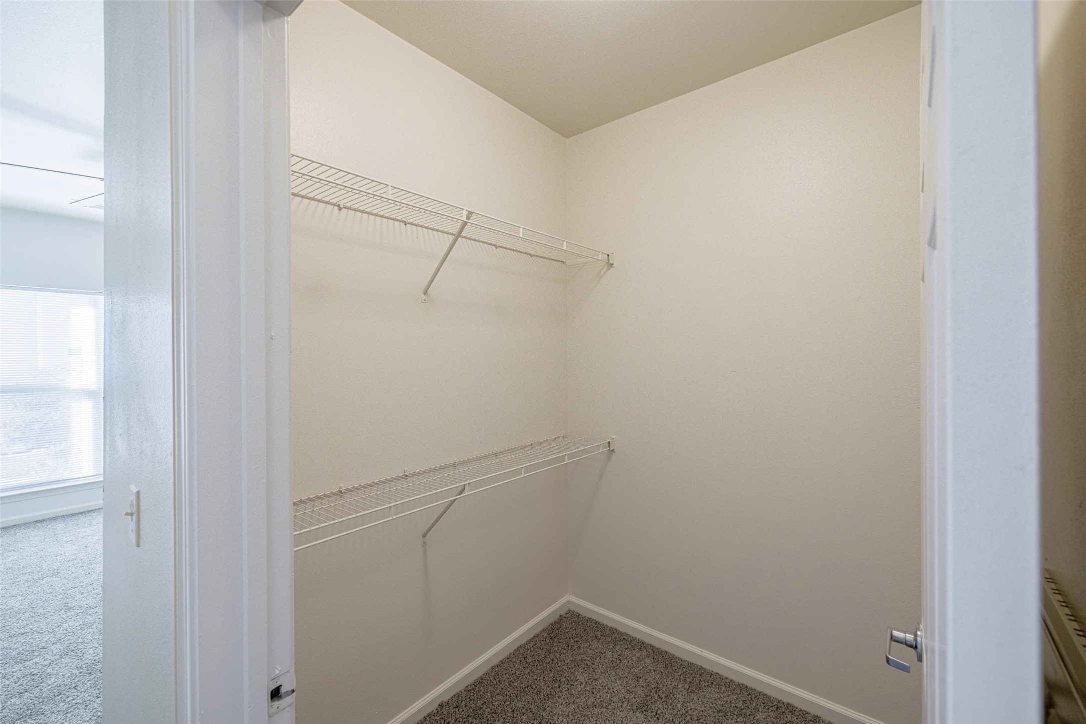 5605 Springdale Road, Unit 444421 Austin, TX 78723 - Photo 6 of 21 a view of a room with racks on the wall