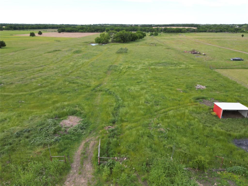 0 Pruett Road Krum, TX 76249 - Photo 25 of 40 a view of a lake from a yard