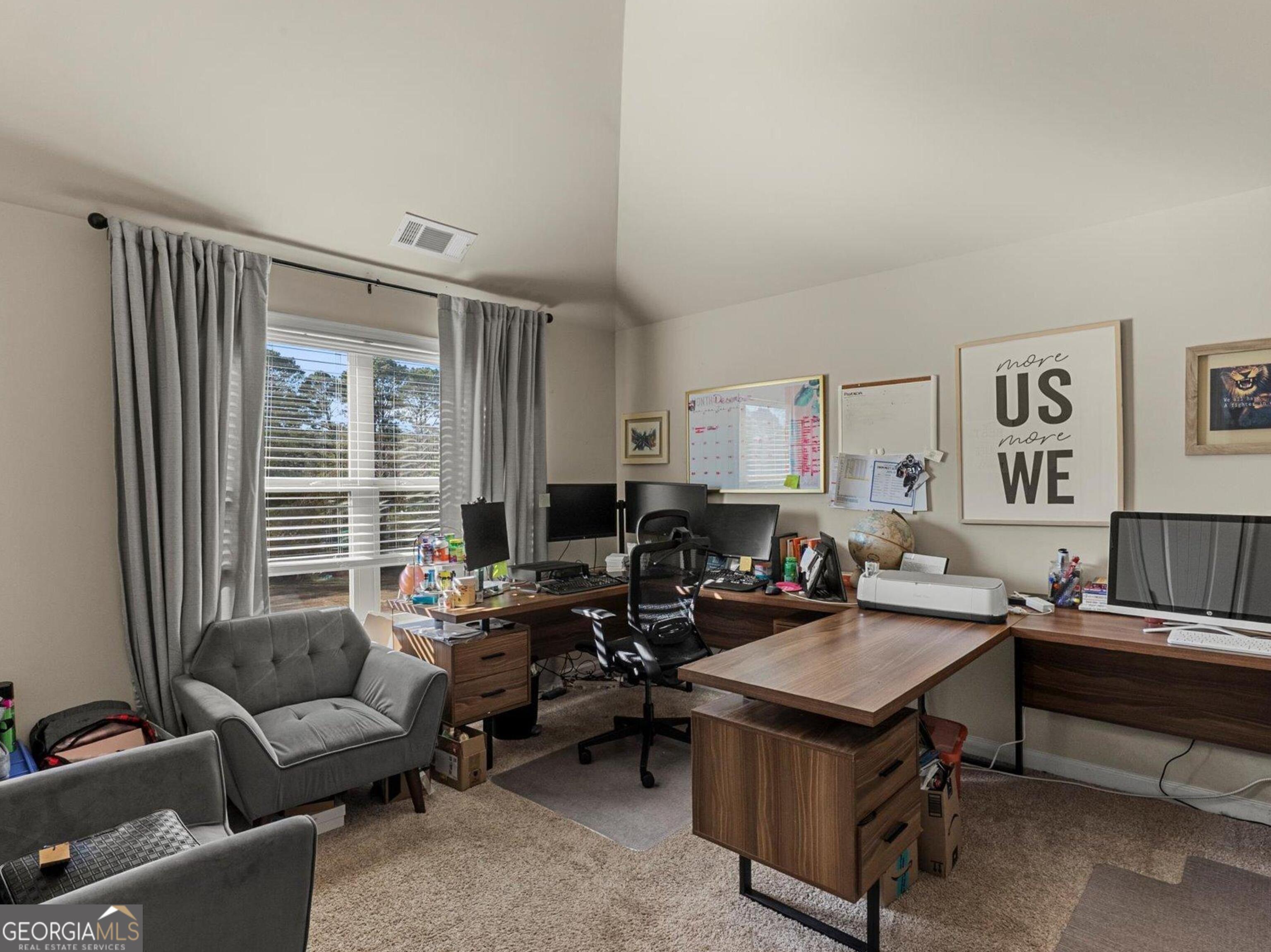 976 Jackson Street Locust Grove, GA 30248 - Photo 12 of 17 a living room with furniture and a window