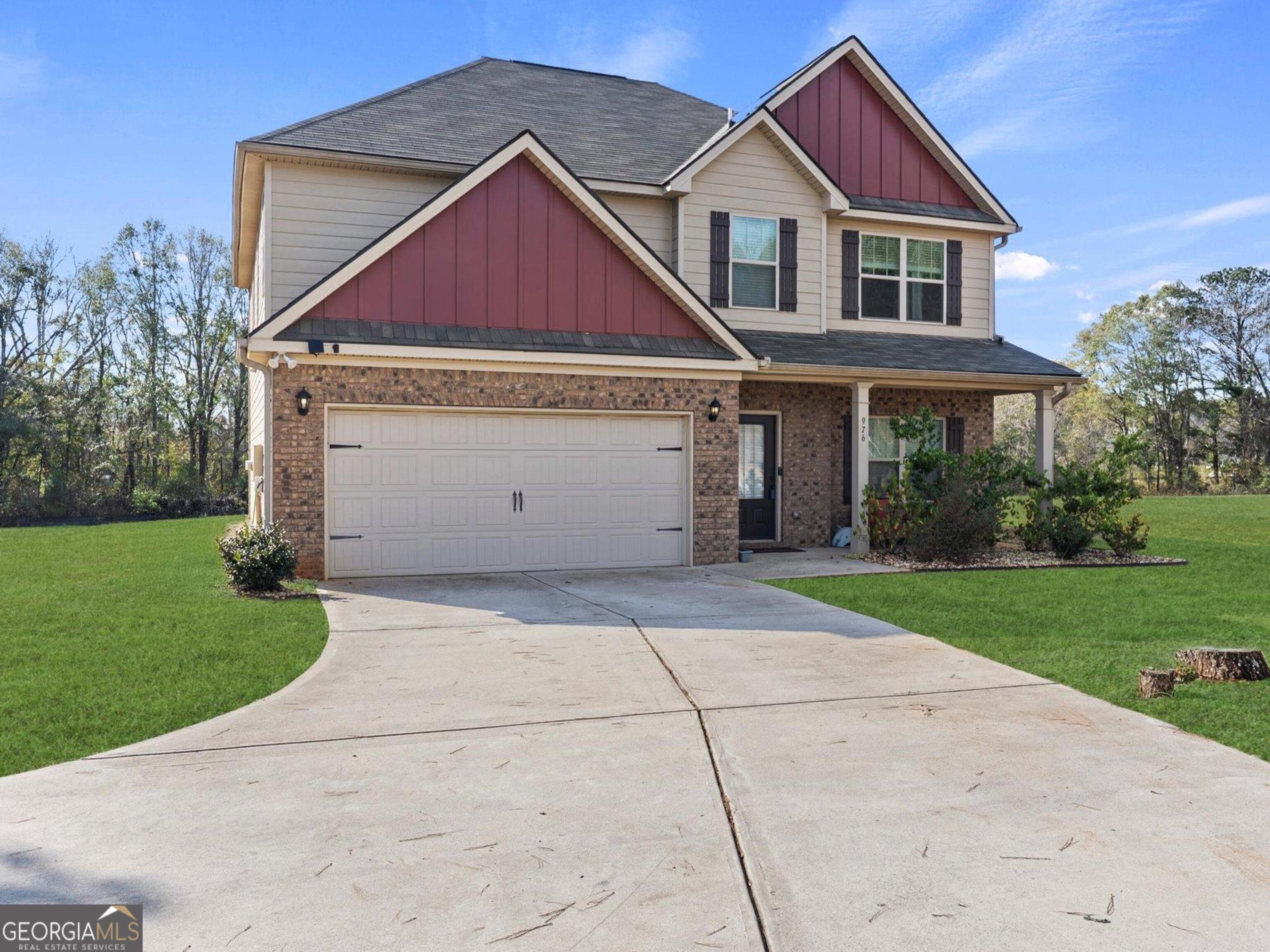 976 Jackson Street Locust Grove, GA 30248 - Photo 2 of 17 a view of a yard in front of house