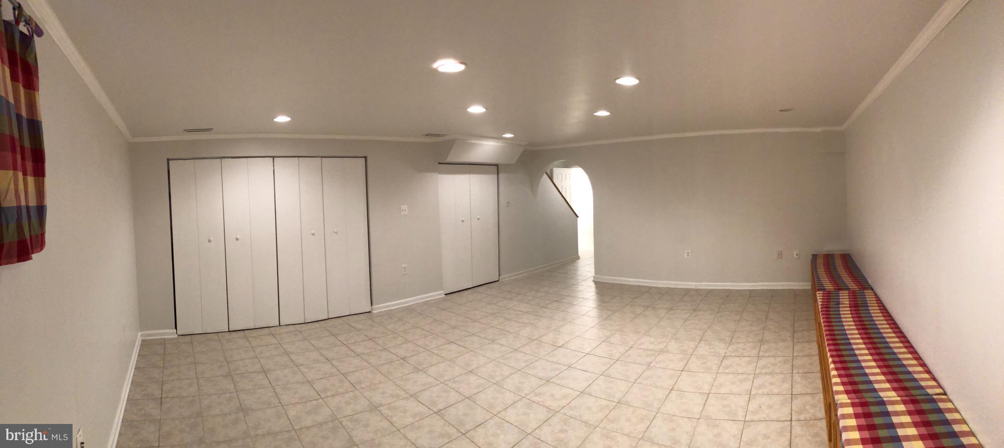 7913 Treeside Court Springfield, VA 22152 - Photo 11 of 14 Basement wall of closets
