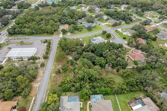 an aerial view of house with a yard
