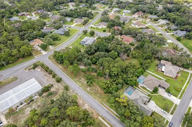 an aerial view of house with yard