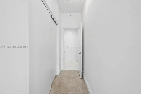 a view of hallway with closet