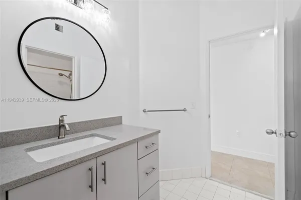 a bathroom with a sink and a mirror