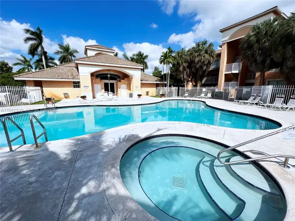 a view of a house with swimming pool