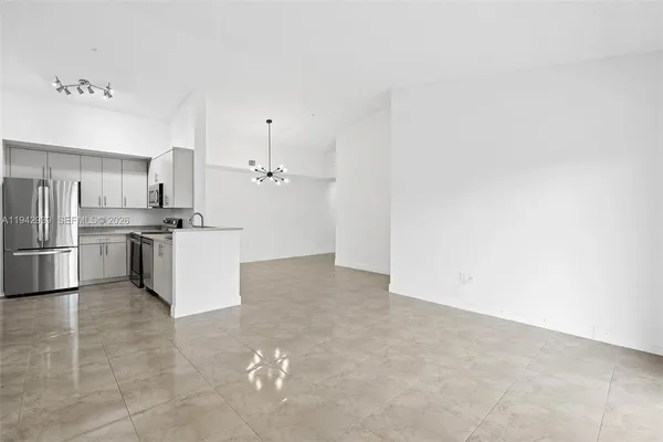 a kitchen with cabinets and stainless steel appliances