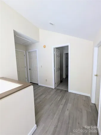 an empty room with wooden floor