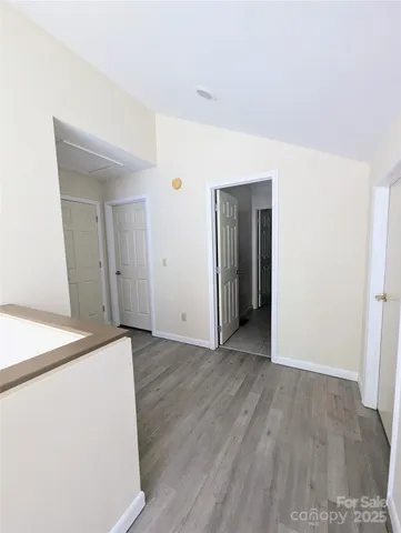 an empty room with wooden floor