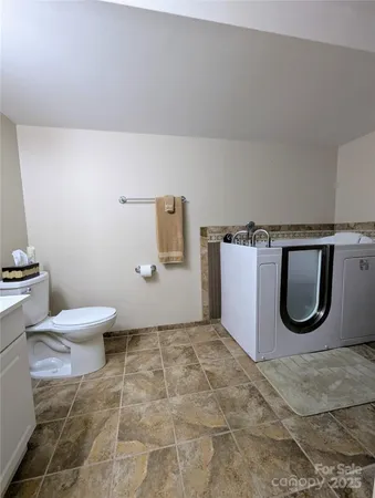 a bathroom with a toilet and a sink