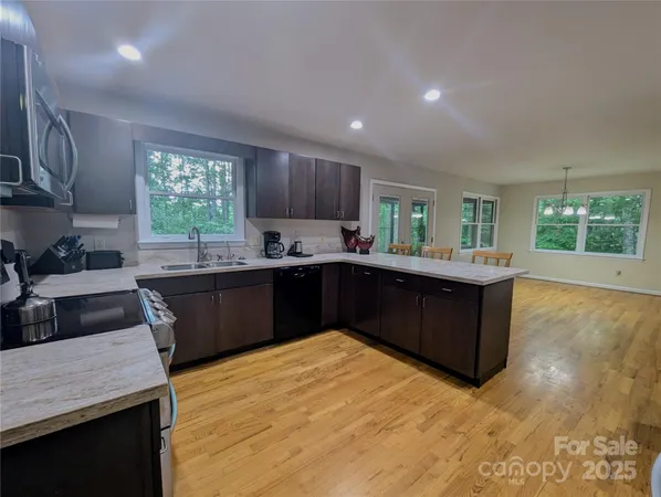 a kitchen with a sink stove and cabinets