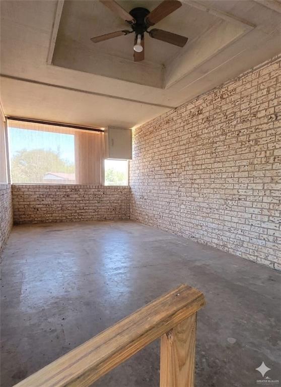 4347 Highway 83 Rio Grande City, TX 78582 - Photo 12 of 15 This versatile space features exposed brick walls, a concrete floor, and a ceiling fan