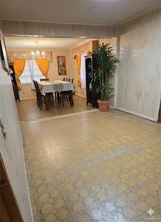 a view of a livingroom with furniture and a window