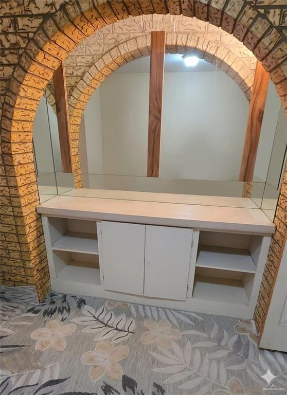 4347 Highway 83 Rio Grande City, TX 78582 - Photo 8 of 15 Vanity room. This room features a decorative brick archway with a built-in storage unit below