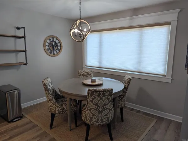 a view of a dining room with furniture and window
