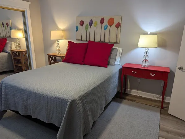 a bedroom with a bed and window