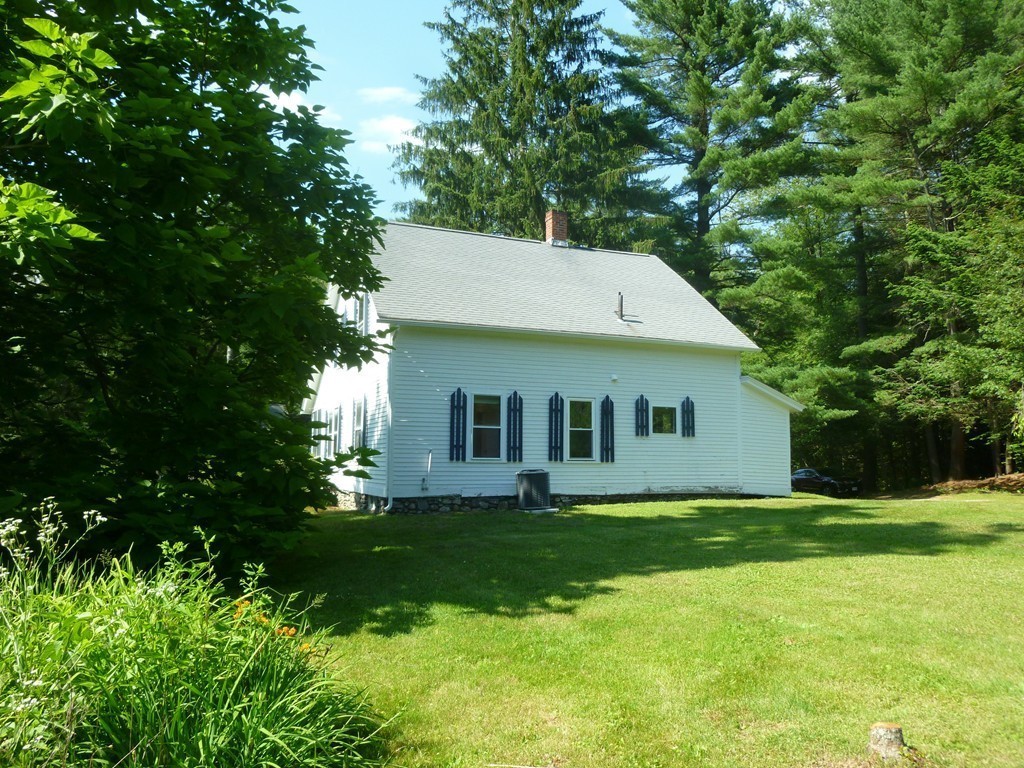16 Jones Road Pelham, MA 01002 - Photo 14 of 15 a view of a house with a yard