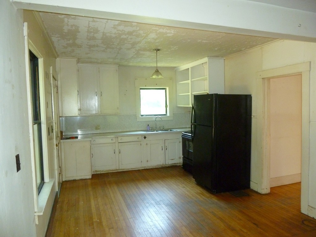 16 Jones Road Pelham, MA 01002 - Photo 3 of 15 a room with a refrigerator and a dresser