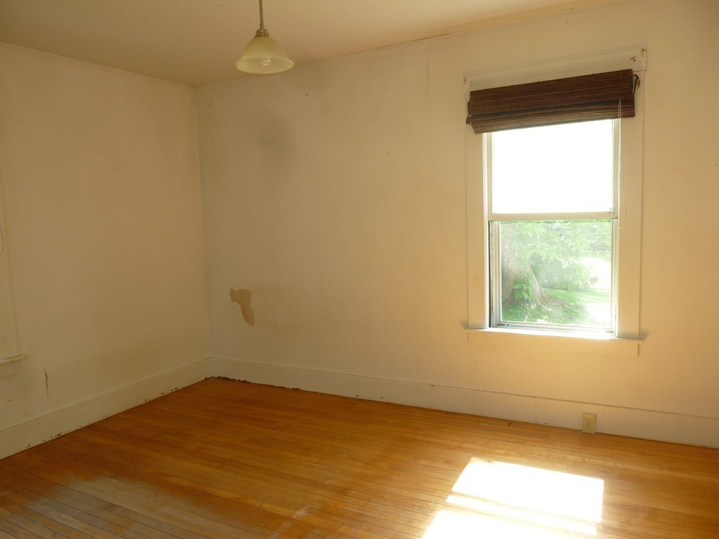 16 Jones Road Pelham, MA 01002 - Photo 7 of 15 an empty room with a window
