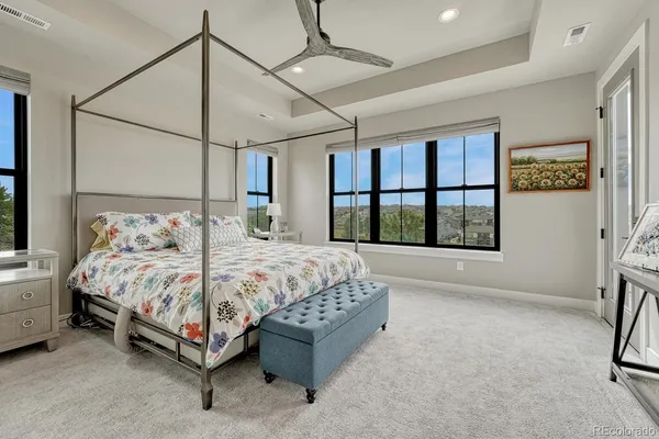 a bedroom with a bed and a table
