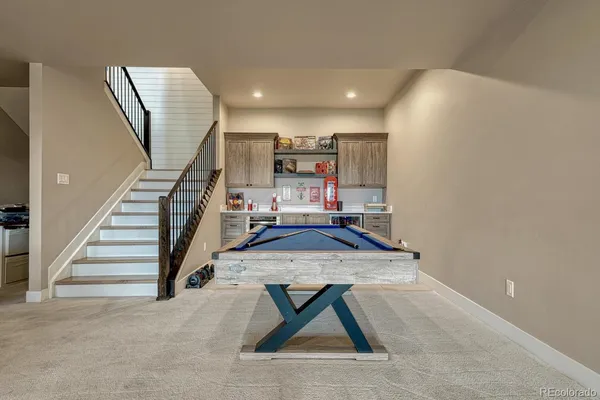a living room with furniture and a rug