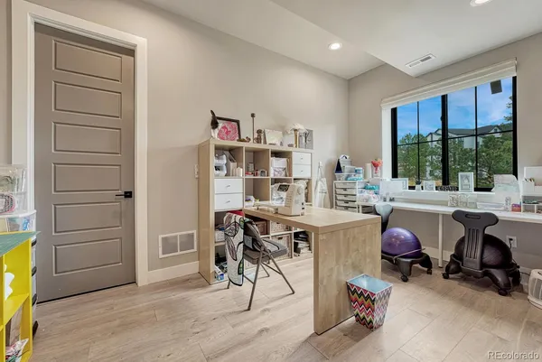 a bedroom with a large bed and a large window