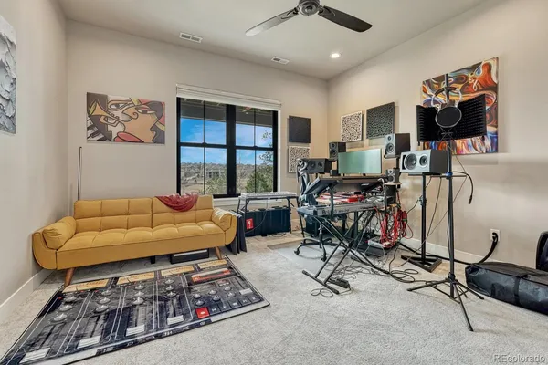 a balcony with furniture and a potted plant