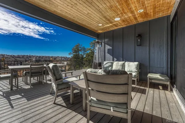 a view of a balcony with wooden floor