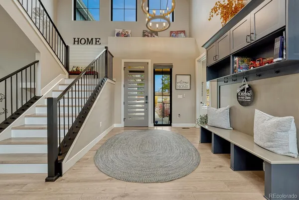 a view of a livingroom with furniture and staircase