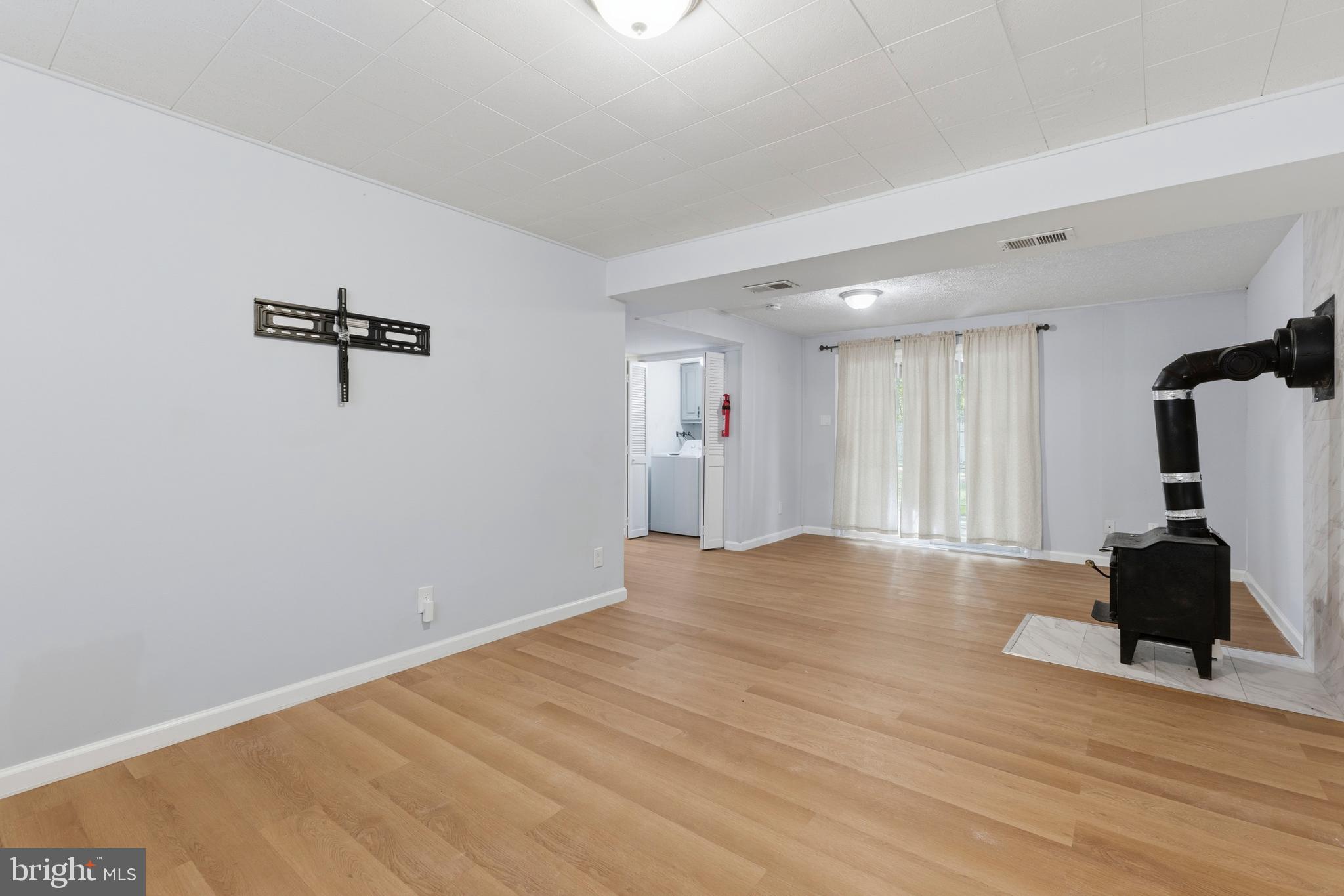 119 Jefferson Road Waldorf, MD 20602 - Photo 25 of 40 a view of a room with a ceiling fan and hardwood floor