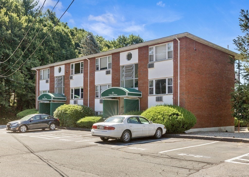 a view of street with parked cars