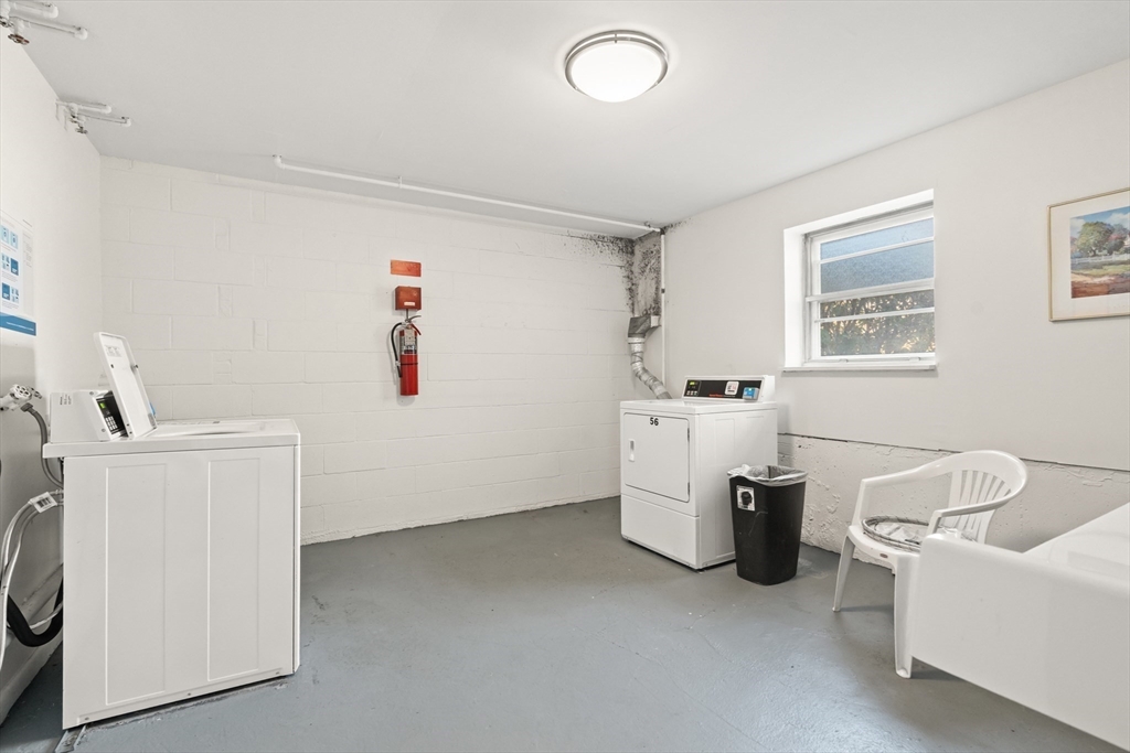2 Colonial Drive, Unit E25 Andover, MA 01810 - Photo 14 of 17 a living room with furniture and a window