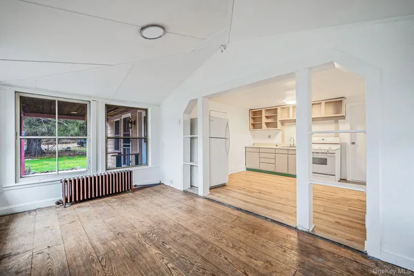 a view of a room with a large window