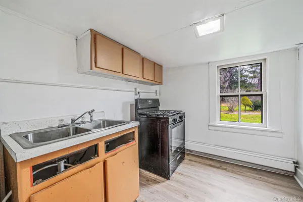 a utility room with sink dryer and washer