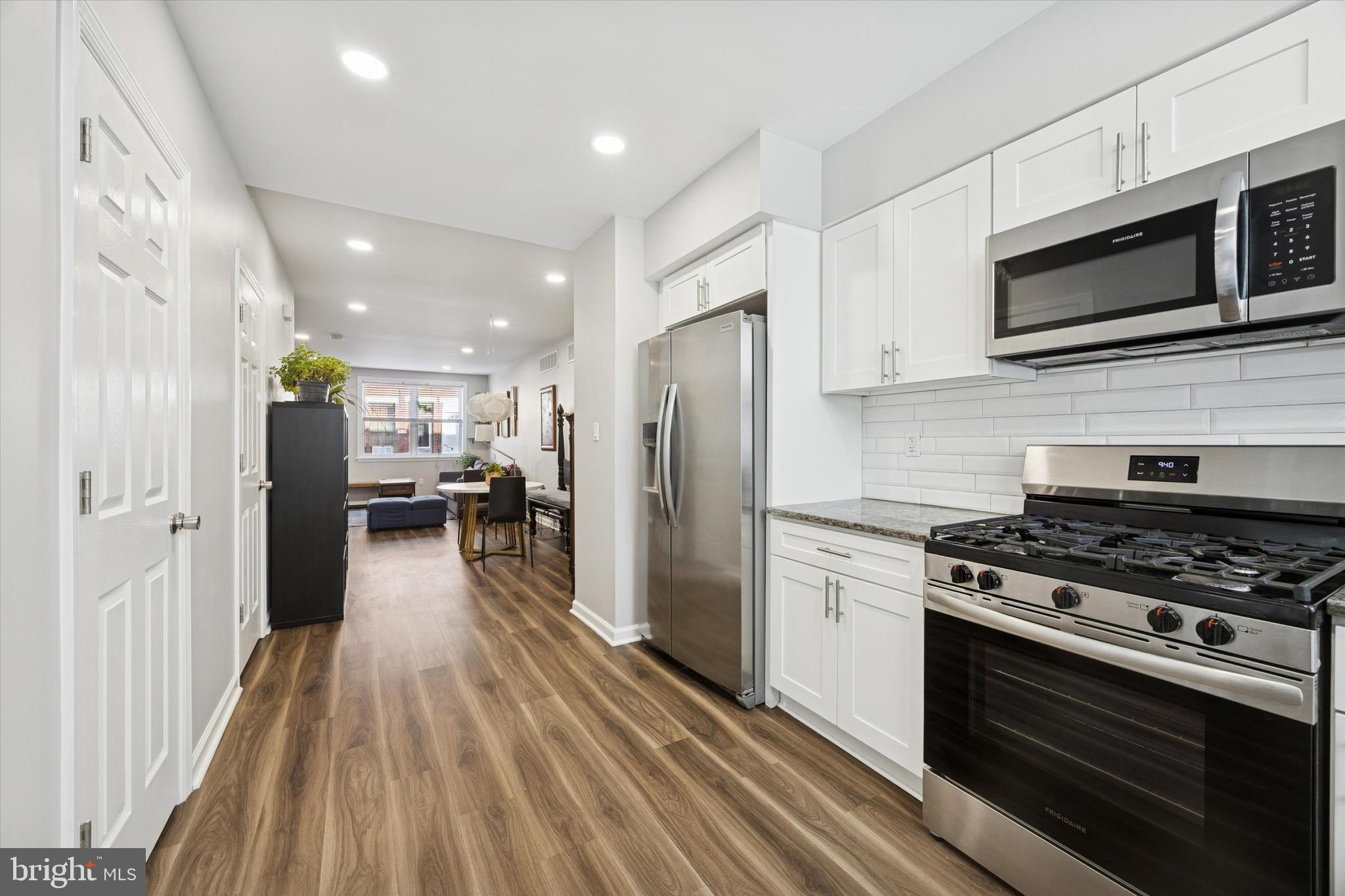 720 Tree Street Philadelphia, PA 19148 - Photo 11 of 26 a kitchen with stainless steel appliances a stove microwave and a refrigerator