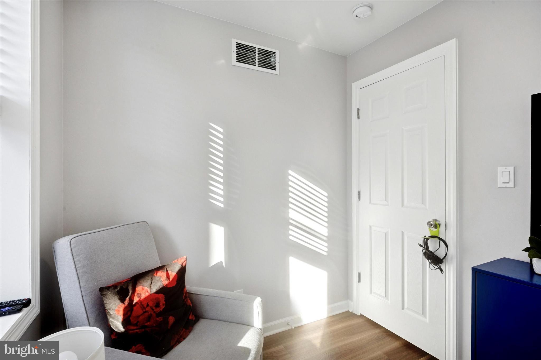 720 Tree Street Philadelphia, PA 19148 - Photo 16 of 26 a living room with furniture and a window
