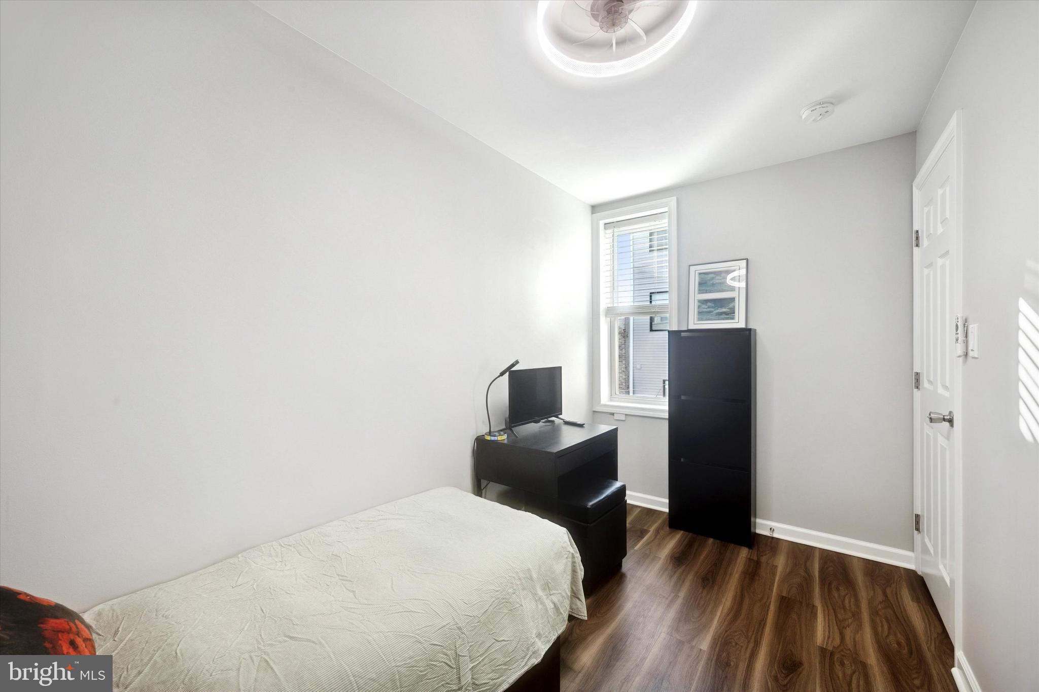 720 Tree Street Philadelphia, PA 19148 - Photo 17 of 26 a bedroom with a bed and furniture