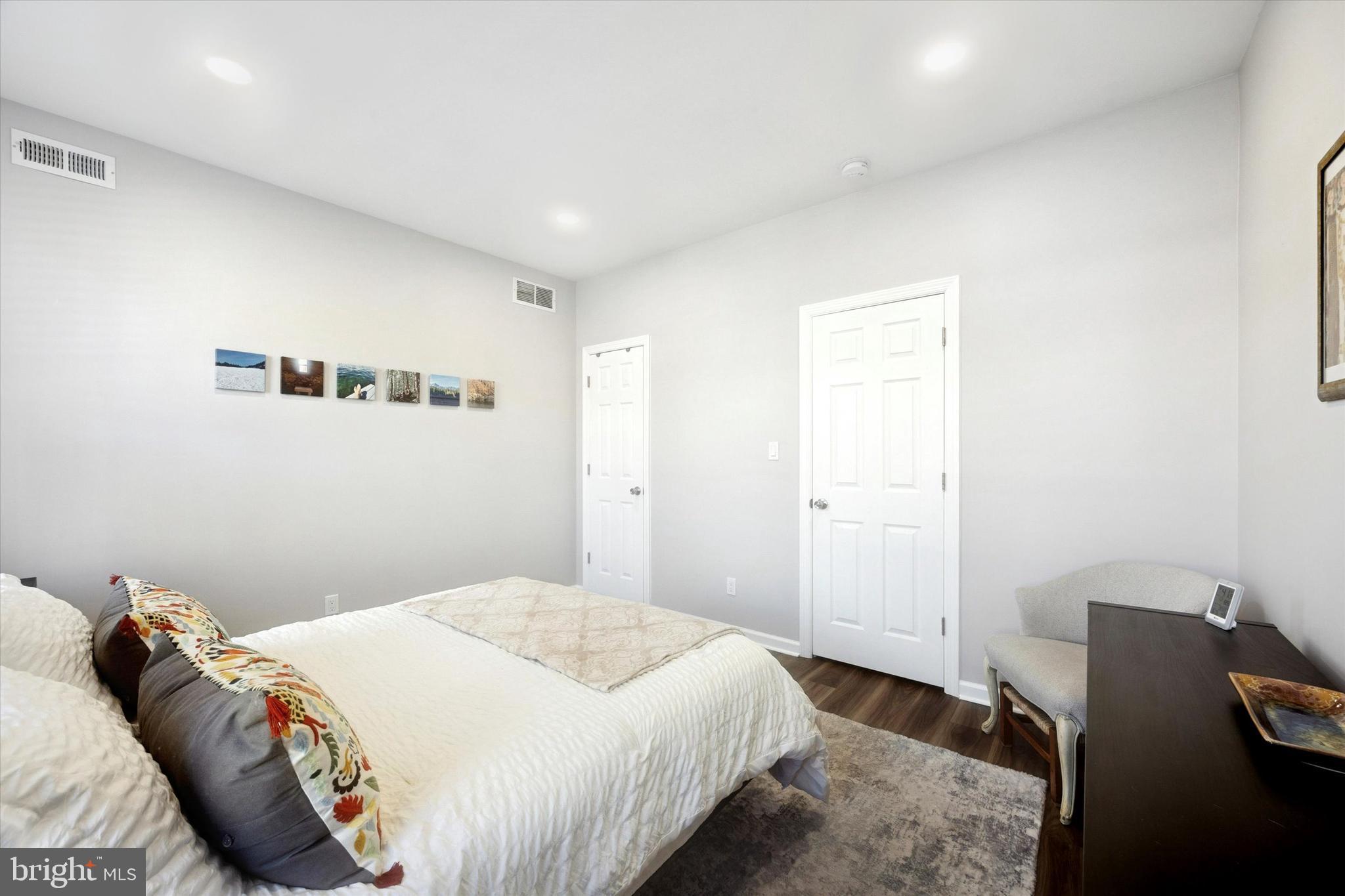 720 Tree Street Philadelphia, PA 19148 - Photo 21 of 26 a bedroom with a bed and chair