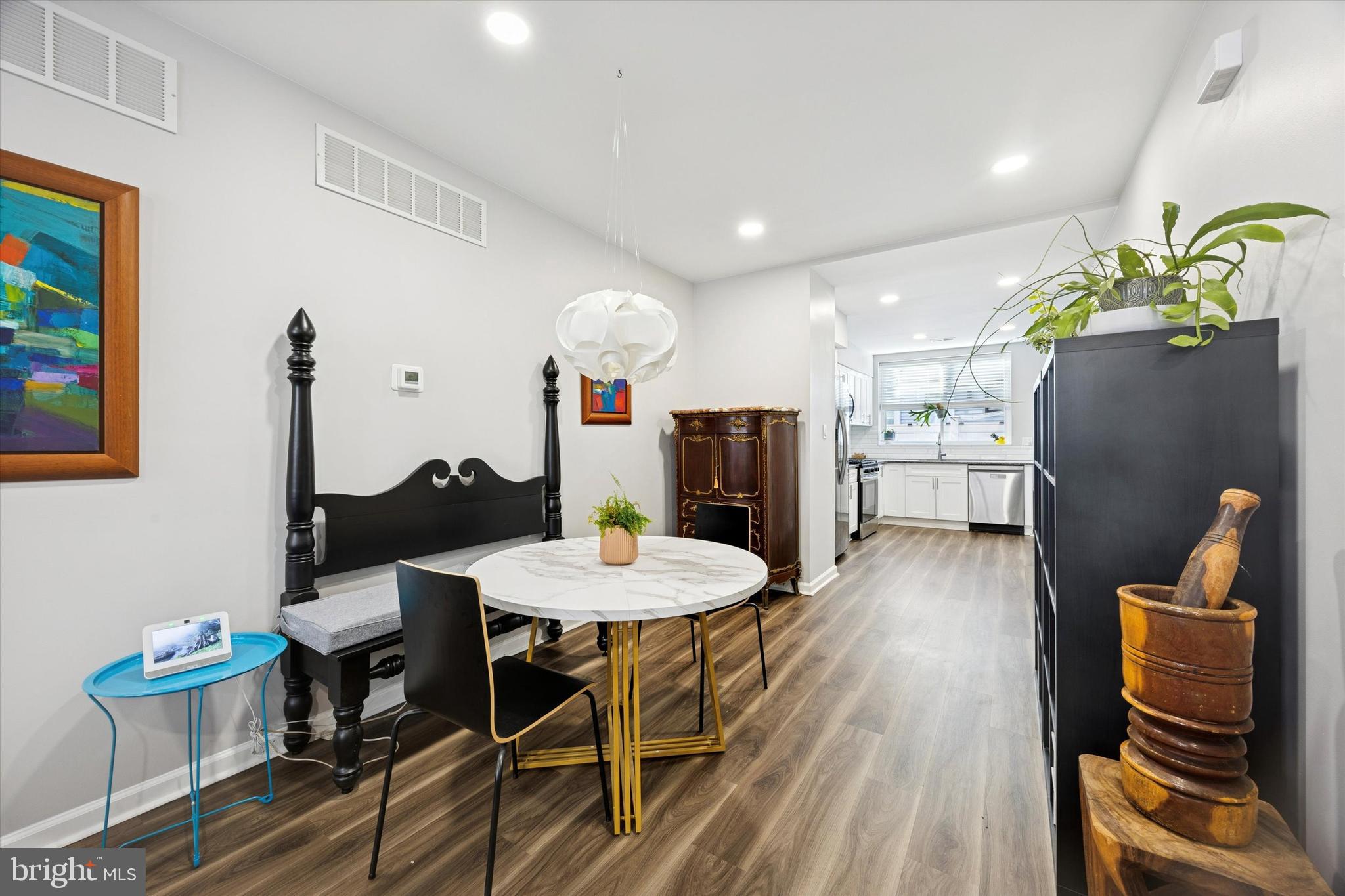 720 Tree Street Philadelphia, PA 19148 - Photo 6 of 26 a view of a dining room with furniture and wooden floor