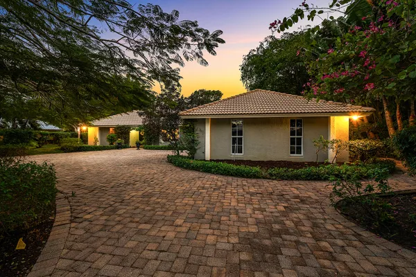 $995,000 | 416 South Country Club Drive, Atlantis, FL 33462