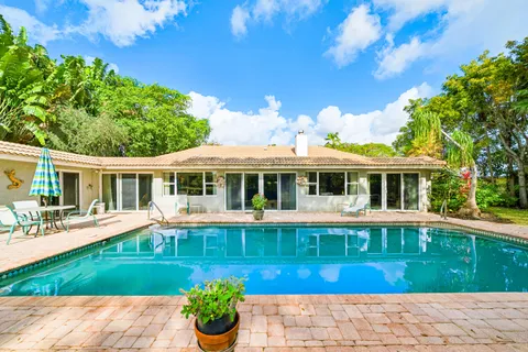 $995,000 | 416 South Country Club Drive, Atlantis, FL 33462