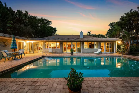 $995,000 | 416 South Country Club Drive, Atlantis, FL 33462