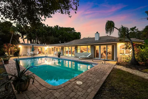 $995,000 | 416 South Country Club Drive, Atlantis, FL 33462